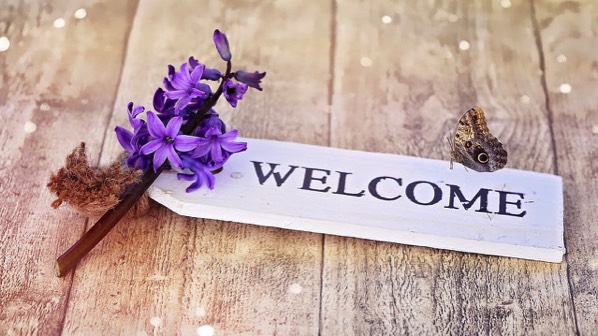 Welcome sign with flower and butterfly